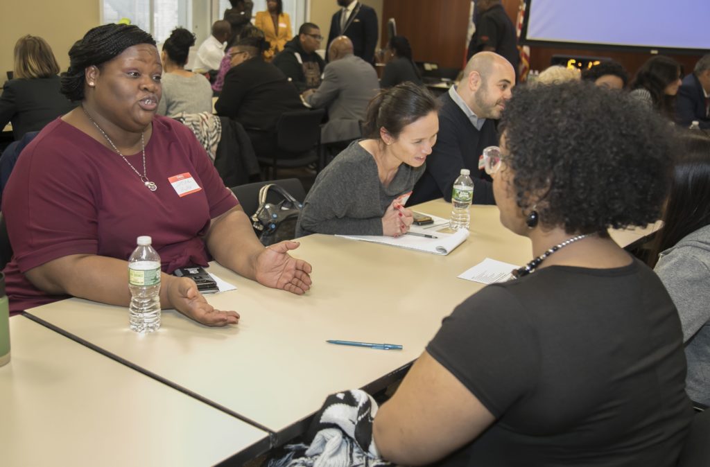 Acting Executive Vice President of Leased Housing Lakesha Miller (left) and Senior Advisor in the Office of the Chief Administrative Officer Camille Ky-Smith (second from left) with proteges.