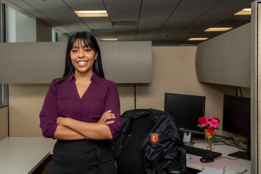 woman standing in front of desk