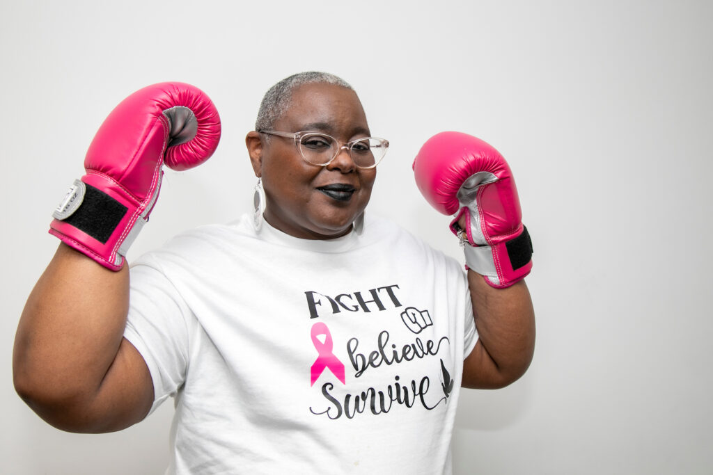 woman wearing pink boxing gloves