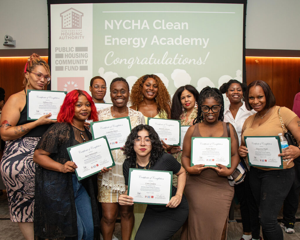 group of women holding certificates