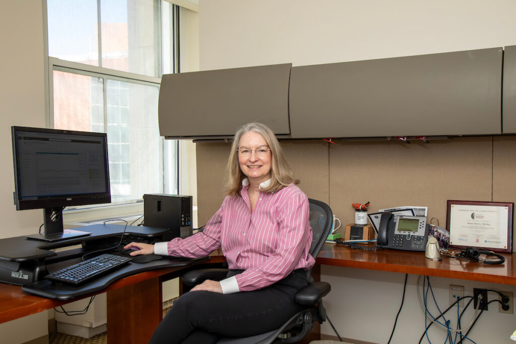 woman seated at desk
