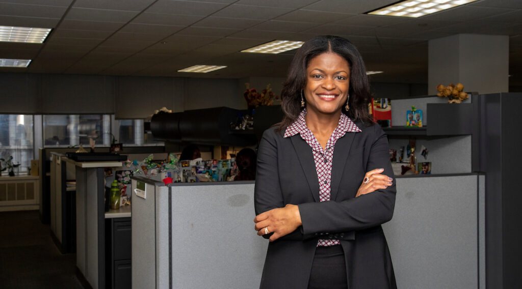 woman standing in front of cubicle