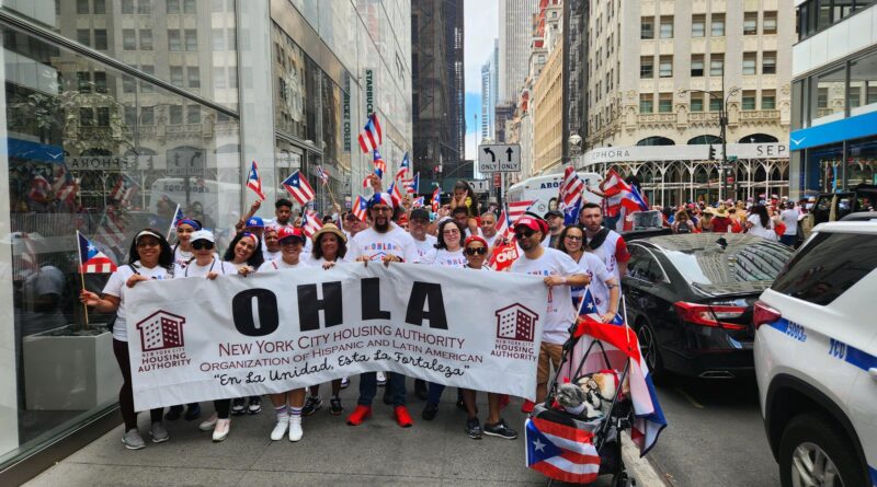 group of people holding OHLA banner at PR Day Parade