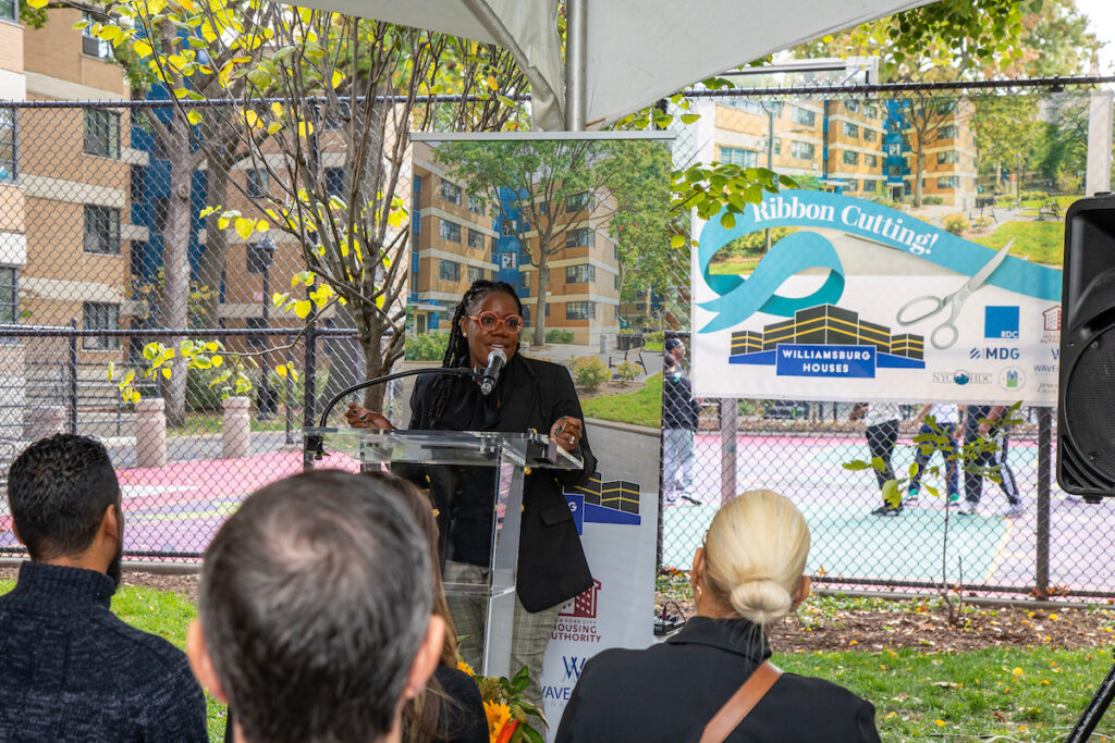 woman speaking at podium