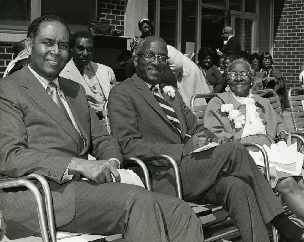 black and white photo of three people