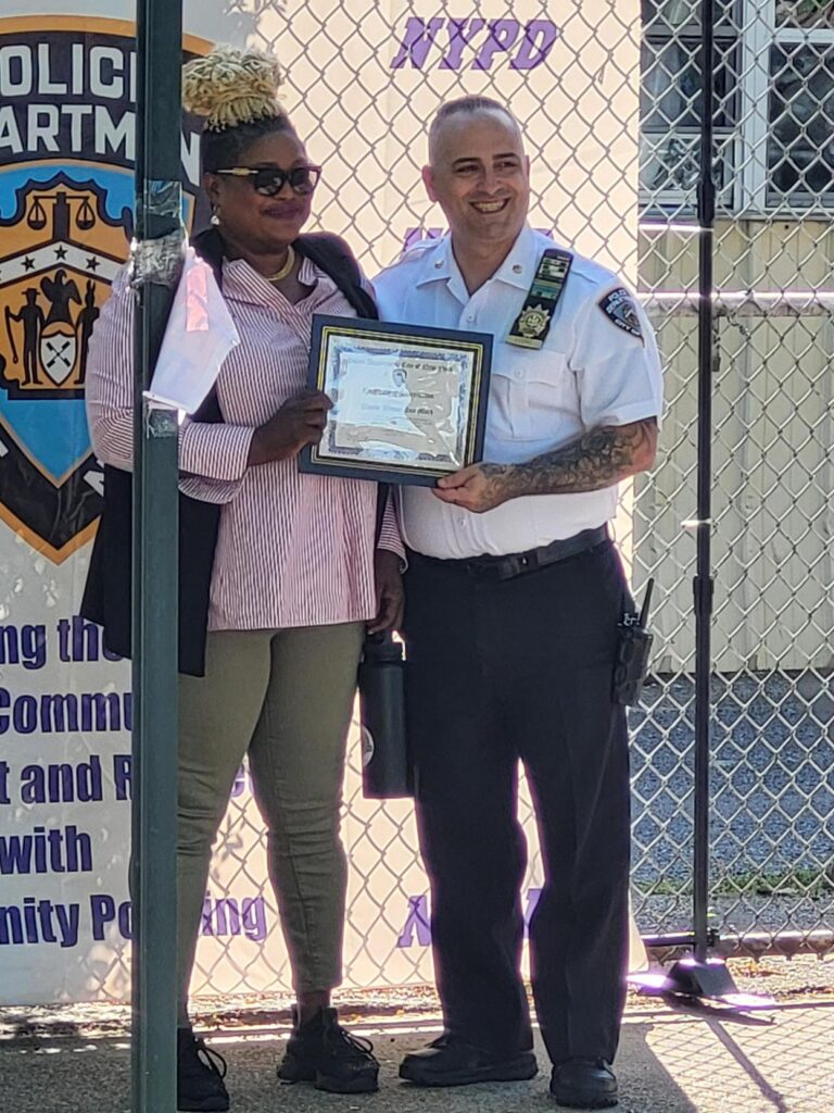 two people holding a certificate