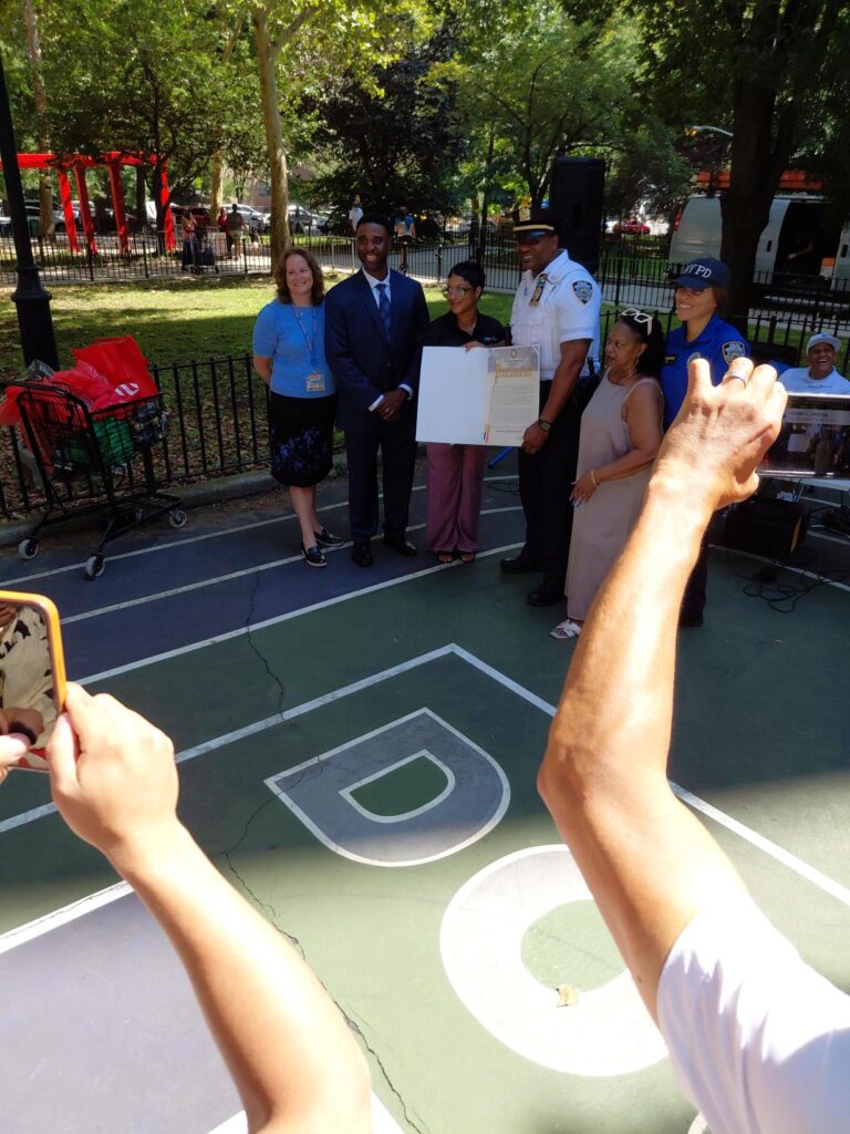 people taking photos of a small group of people
