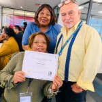 Administrative Staff Analyst Enrique Parajon presenting a certificate of appreciation