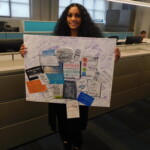 Customer Information Representative Donna Edmonds with the "positive affirmation" signing board