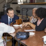 Heating Management Services Department Director Javier Almodovar with residents Resident Leadership Breakfast