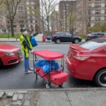 A volunteer helping to distribute meals.