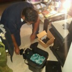 An exterminator pre-baiting in an apartment. Note: Photo taken pre-COVID-19.