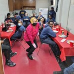 Staff enjoy a luncheon at Parkside Houses in the Bronx. Customer Service Parkside luncheon