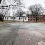 Pomonok's basketball court space before the renovations. Pomonok basketball court before